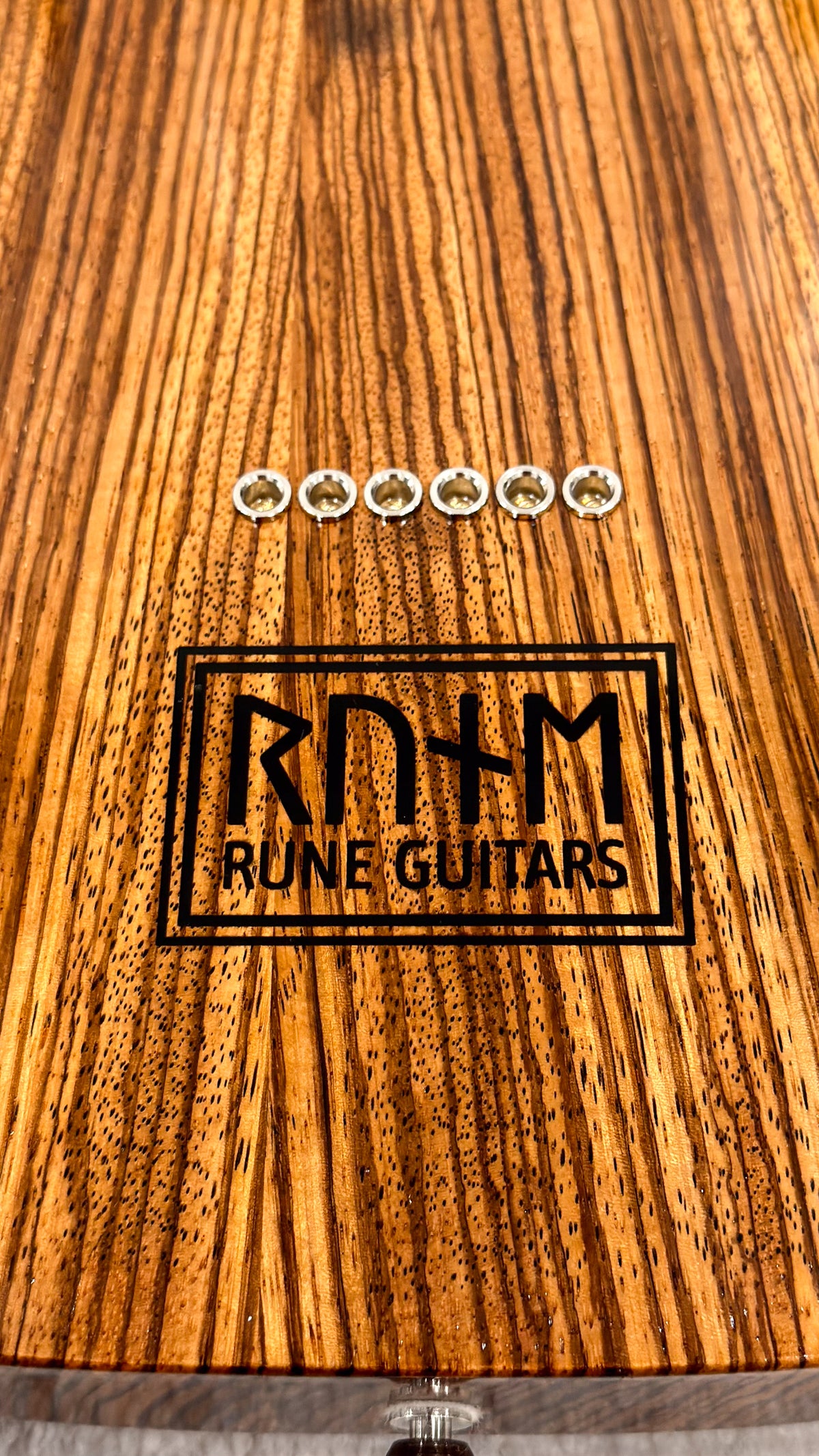 T-Style Zebrawood, Rune Guitars logo and string ferrules on the back