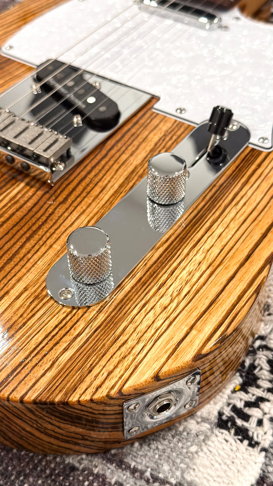 T-Style Zebrawood, close-up of bridge pickup, control knobs and output jack